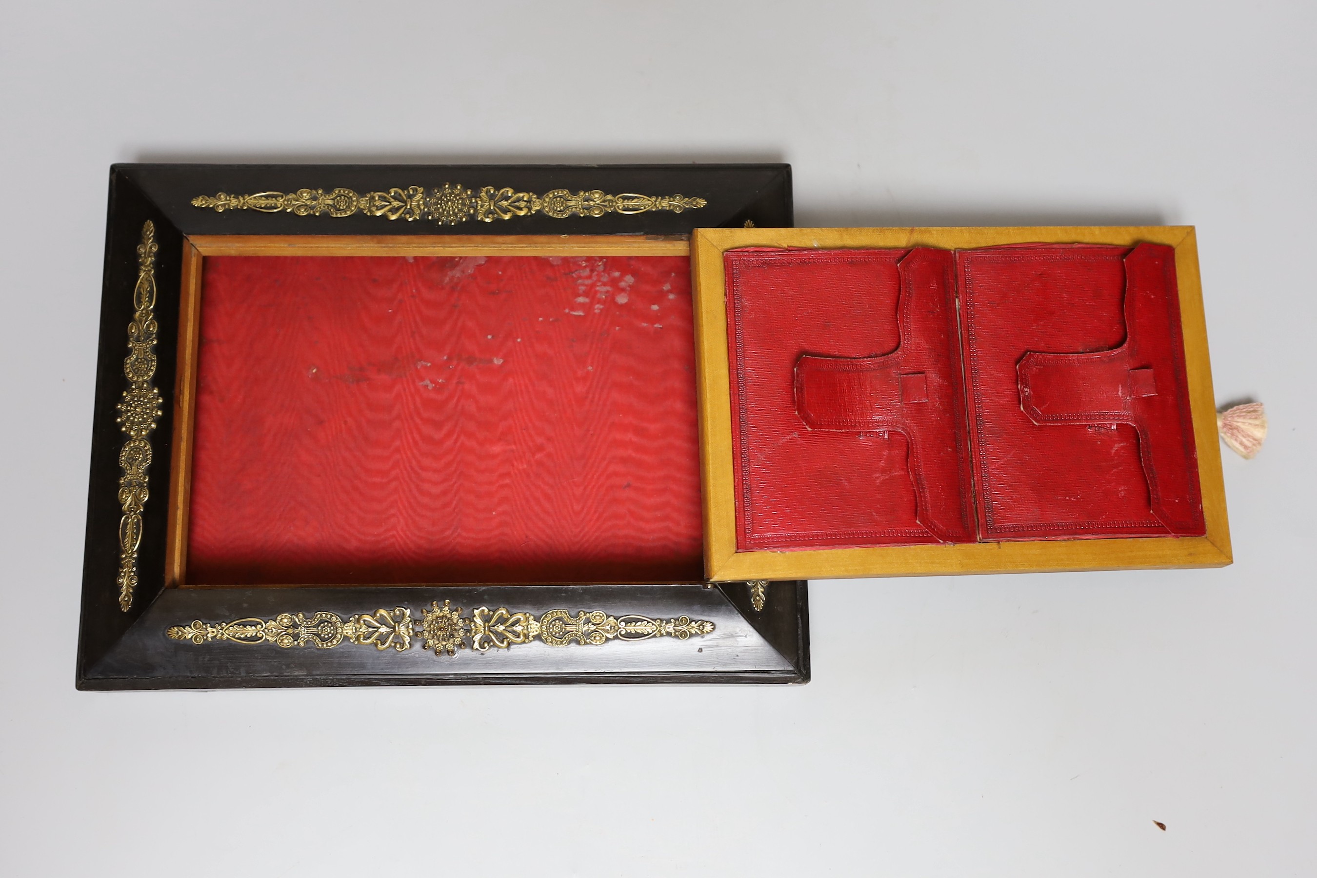 A 19th century French reverse painted glass, ebony veneered stationery safe box with ormolu mounts and red Morocco leather interior, makers mark Alph. Giroux, Paris, 28.5cms wide, 22cms deep